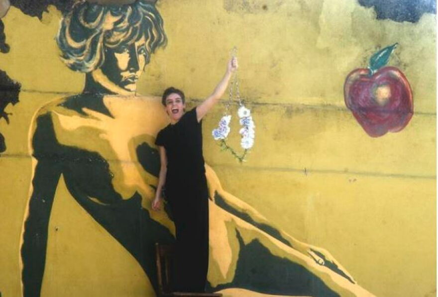 In November 2005, artist Justine Wollaston removes the cover over Eve’s breasts from her mural in downtown Pilot Point. The city of Pilot Point had dropped its lawsuit against building owner Wes Miller, after claiming that the mural was pornographic.