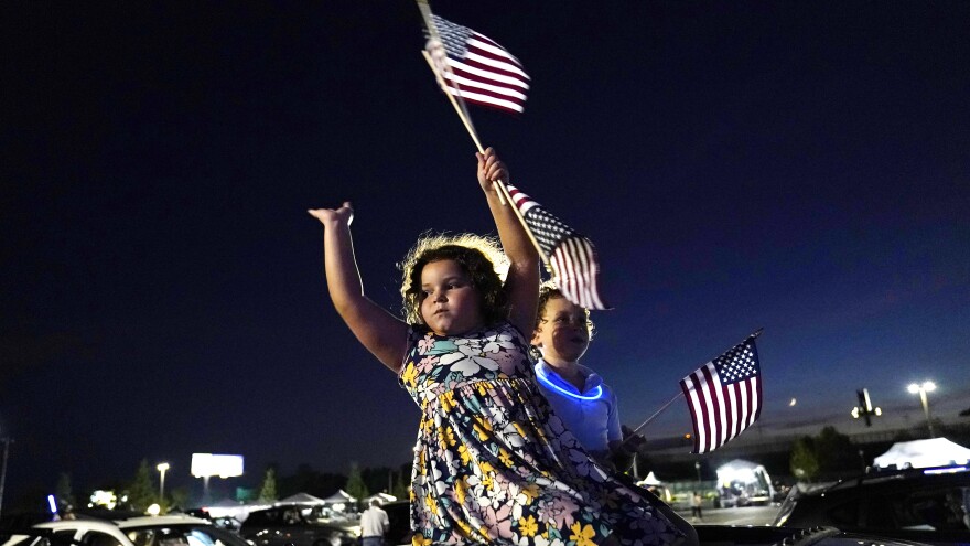 Alessandra Goldstein, 6, and her family watched Joe Biden accept the nomination Thursday night from their car outside of the Chase Center in Wilmington, Del.