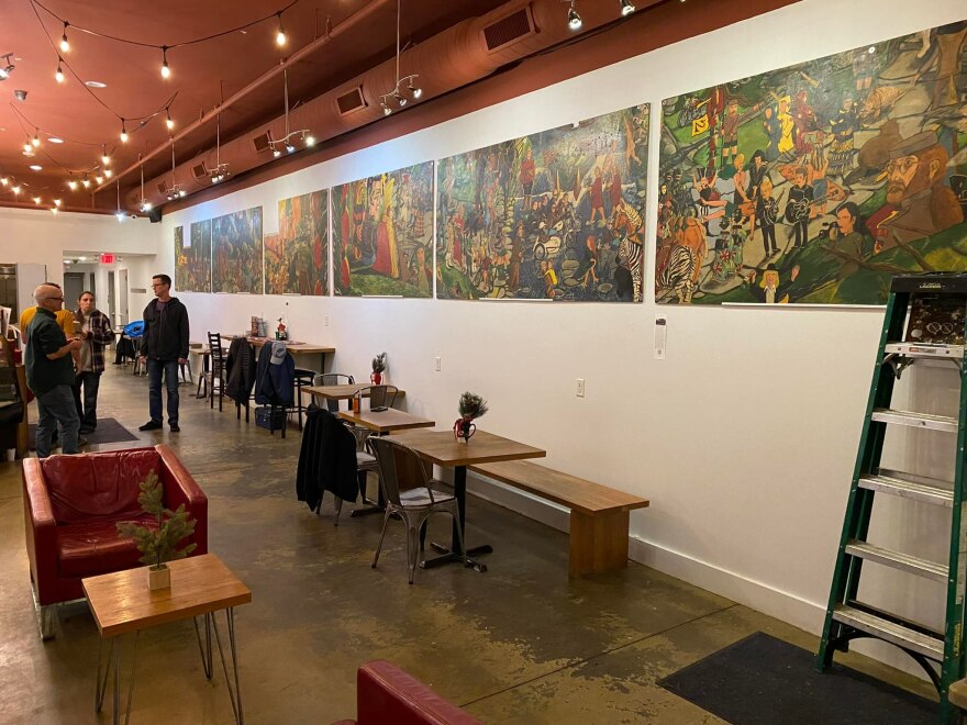 Mural art painted by Steven Turner hangs on the walls at Sidecar Coffee in Cedar Falls.