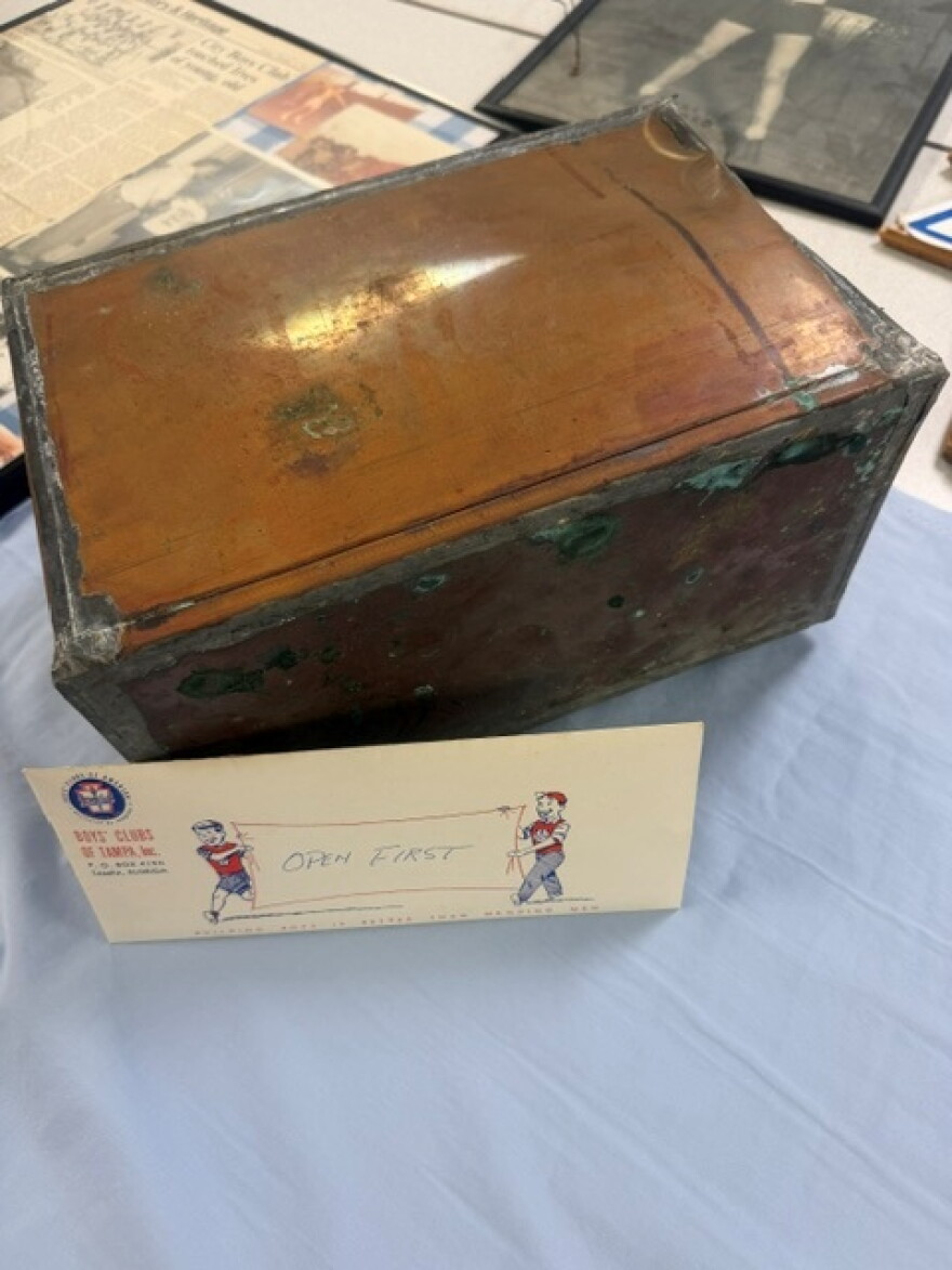A small copper tin box t