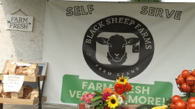 A sign for a roadside farm stand.