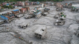 A drone view of the aftermath of flash flooding along the Trishuli River in the Devighat area of Nuwakot district, Nepal, Saturday, Aug. 29, 2026. 