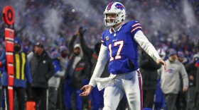 Buffalo Bills quarterback Josh Allen (17) reacts after throwing a touchdown pass to tight end Dalton Kincaid (86) during the first quarter of an NFL wild-card playoff football game, Monday, Jan. 15, 2024, in Buffalo, N.Y. (AP Photo/Jeffrey T. Barnes)