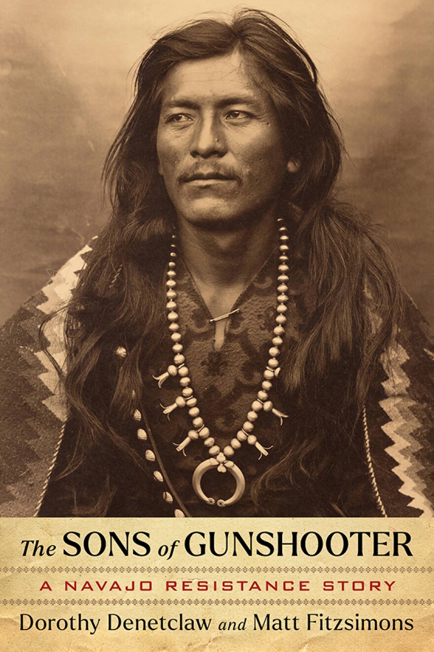 Photo of male Native American with text: "The Sons of Gunshooter A Navajo Resistance Story Dorothy Denetclaw and Matt Fizsimons"
