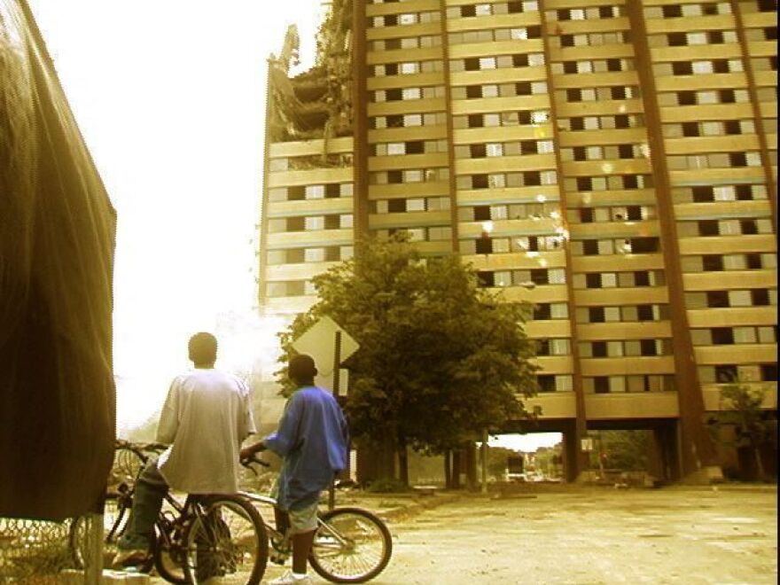This still from the documentary film <em>East of Liberty</em> shows two young boys in Pittsburgh looking up at a building facing demolition.
