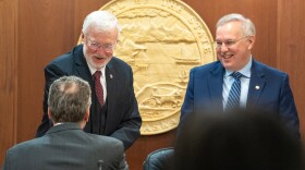 Senate President Gary Stevens, R-Kodiak, greets Gov. Mike Dunleavy while standing alongside House Speaker Bryce Edgmon, I-Dillingham, in the House chamber at the Alaska State Capitol in Juneau on Jan. 28, 2025.