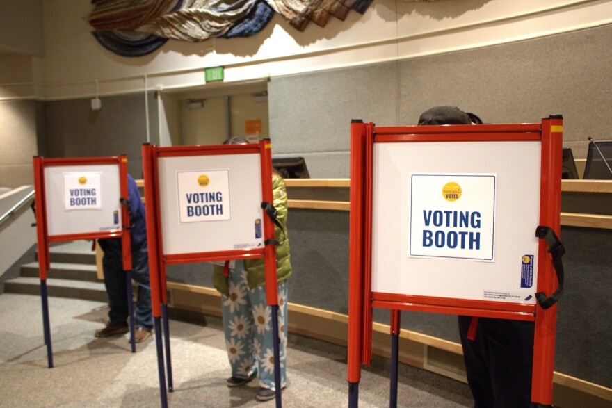 Anchorage voters in voting booths