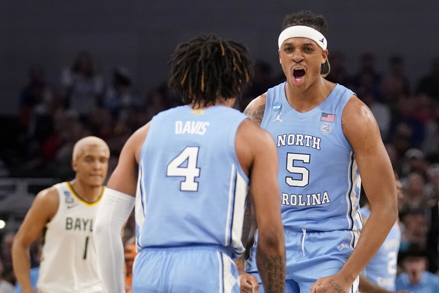 North Carolina guard RJ Davis (4) and forward Armando Bacot (5) celebrate in the second half of a second-round game against Baylor in the NCAA college basketball tournament in Fort Worth, Texas, Saturday, March, 19, 2022.