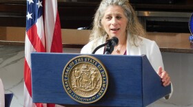 CEO of Undue Medical Debt Allison Sesso speaks about medical debt elimination in Delaware on Wednesday at the New Castle County Hope Center in New Castle, Del.