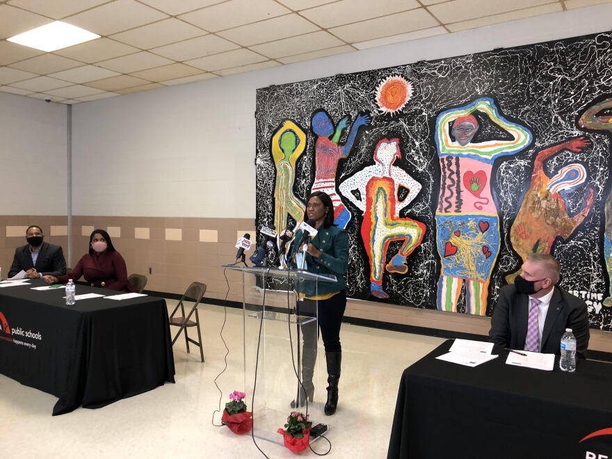 Peoria Public Schools Superintendent Sharon Desmoulin-Kherat, center, speaks about the District's R3 grant award during a news conference Tuesday at Trewyn K-8 School in Peoria. 