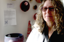 Artist Chris Bettini with her rope bowls that were recovered from the Helene flood. Her work was on display in the Liar's Loft, a Lansing studio opened after Helene to give artists a place to show their creations. PAUL GARBER/WFDD