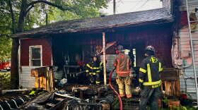 Evansville firefighters on the scene of a fire-damaged home in the 1800 block of Stinson Avenue, Sept. 11, 2026