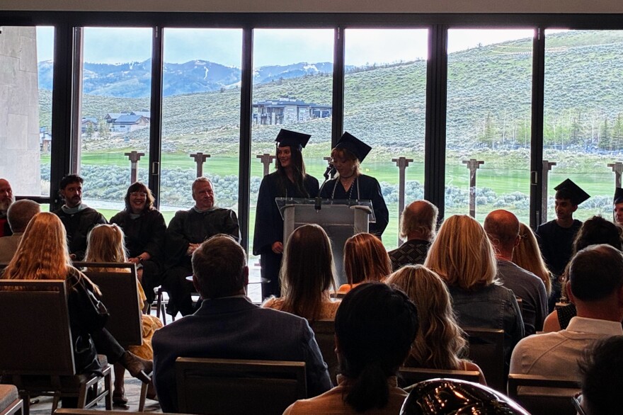 Silver Summit Academy graduates Morgan Vesco and Alexandra Mae Ward speak at the Class of 2026 graduation ceremony.