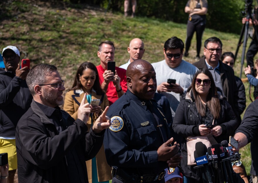 Nashville Police Chief John Drake, center, speaks at a news briefing on Tuesday at the entrance to the Covenant School in Nashville, Tenn.