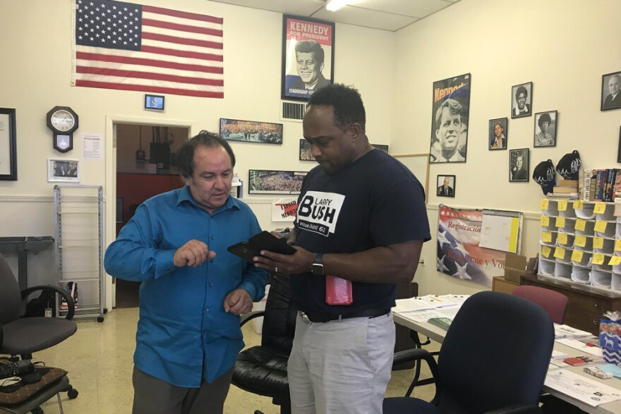 Local Democratic organizer Terry Gresham talks with House District 62 candidate Larry Bush at the Comanche County Democratic Party office in Lawton on September 21, 2018.