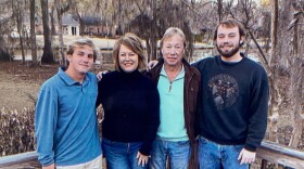 Drew (far right) with his parents and brother.