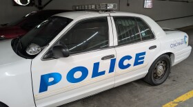 A police car in a garage.