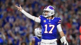 Buffalo Bills quarterback Josh Allen (17) signals for a first down during the first half of an NFL football game against the Jacksonville Jaguars, Monday, Sept. 23, 2024, in Orchard Park, NY. (AP Photo/Adrian Kraus)