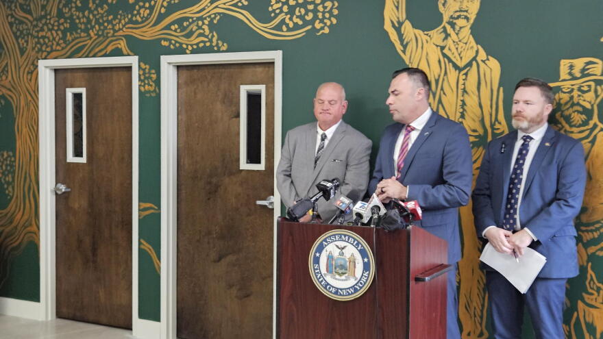 Retired New York State Police Investigator Matthew Stegner, middle, answers a question about the need for independent investigations into sex crime cases and other felonies.