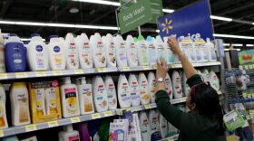 A Walmart employee stocks the shelves at a Walmart store on Feb. 19, 2015, in Miami. (Joe Raedle/Getty Images)
