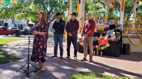 (From left to right) Rep. Melanie Stansbury, New Mexico House Speaker Javier Martínez, Albuquerque City Councilor Joaquin Baca, and Albuquerque Mayor Tim Keller stand in front of an ofrenda set up for the late activist Dolores Huerta in Old Town Albuquerque on Wednesday.
