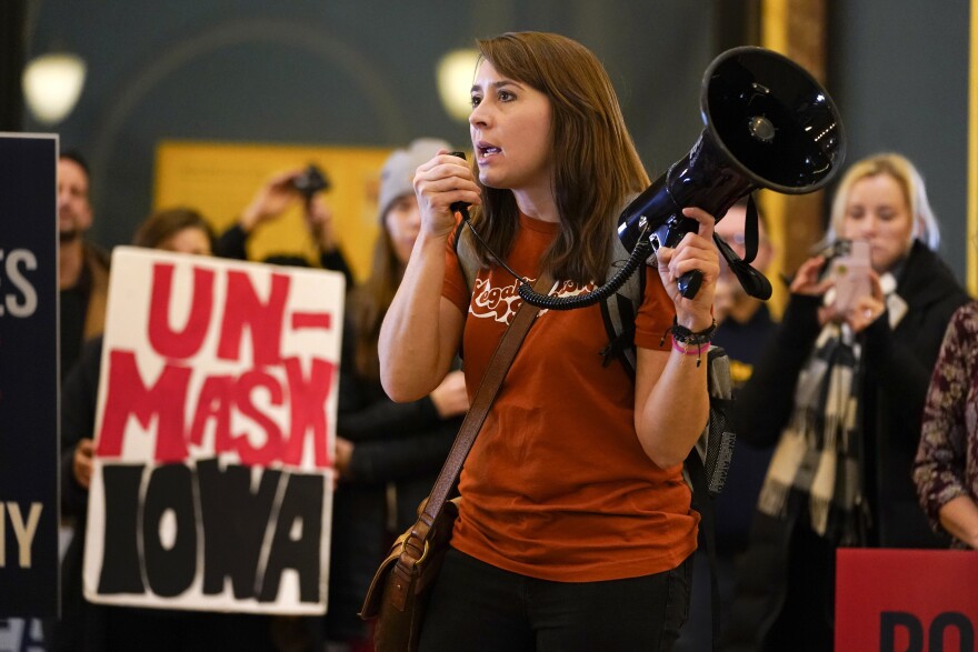 Brei Johnson speaks as protestors gather in the Iowa Capitol rotunda to voice their opposition to mask mandates, Monday, Jan. 11, 2021, at the Statehouse in Des Moines, Iowa.