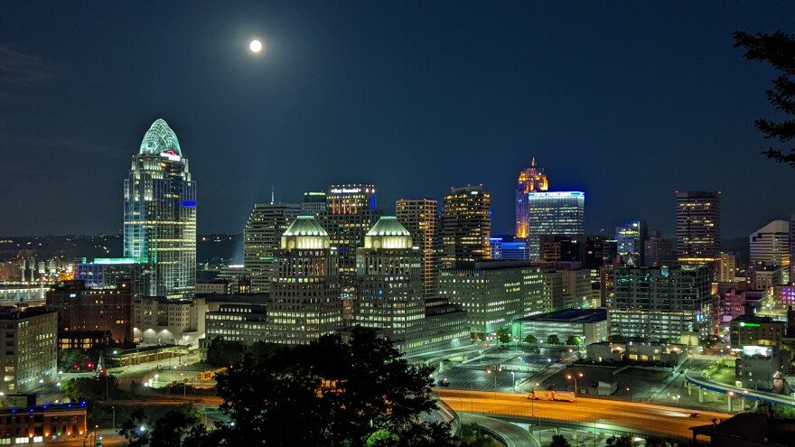 The moon shines over Downtown Cincinnati, early on the morning of July 14, 2022.