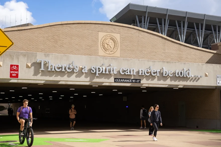 Students walk through a tunnel under Wellborn Road on the Texas A&M University campus in College Station on Nov. 13, 2025.
