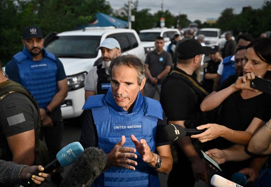 International Atomic Energy Agency (IAEA) chief Rafael Grossi talks to the press on a road outside Zaporizhzhia after his visit to the Russian-held Zaporizhzhia nuclear power plant in southern Ukraine on Sept. 1. Grossi said the "physical integrity" of a Russian-held Ukrainian nuclear plant had been "violated" following frequent shelling, on his team's first visit to the facility.