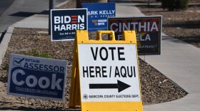 A sign points the way to an early voting location in Phoenix, Arizona on Oct. 16, 2020 ahead of the US presidential election. (Robyn Beck/AFP via Getty Images)