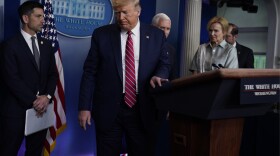 President Donald Trump leaves after speaking at the White House on March 20. a coronavirus task force briefing 