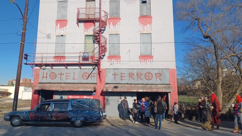 Supporters of letting the Hotel of Terror remain where it is gather in front of the business
