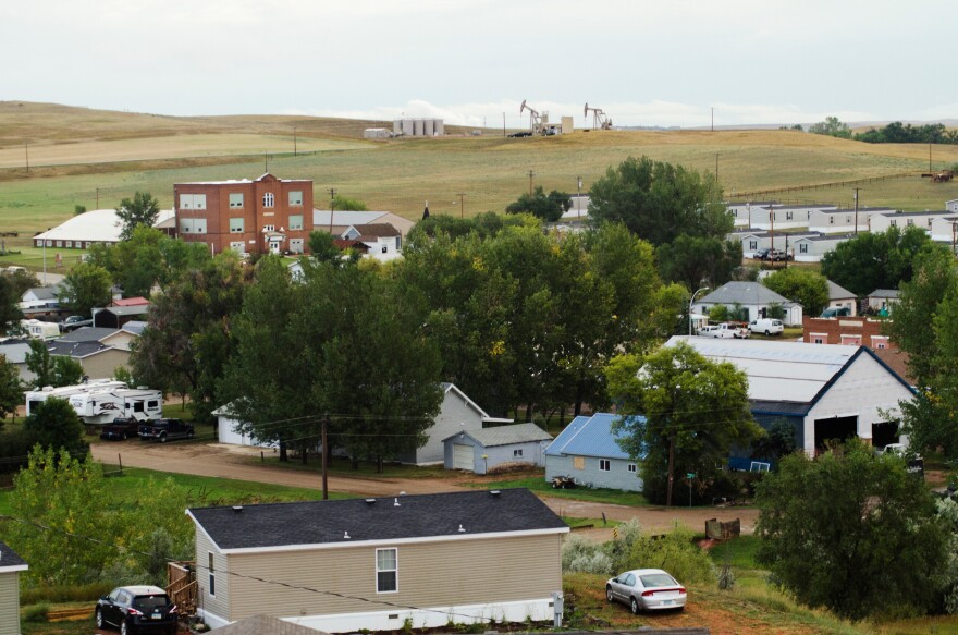 Oil wells sit atop a hill just outside Alexander, N.D., a small town of about 300 in the heart of the Bakken oil patch.