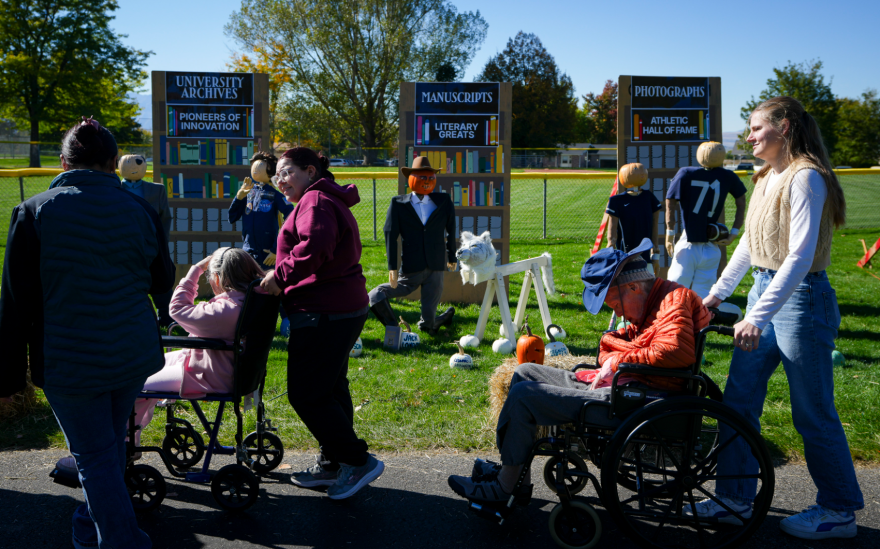 People walk through the annual Pumpkin Walk in North Logan on Thursday, Oct. 15, 2026.