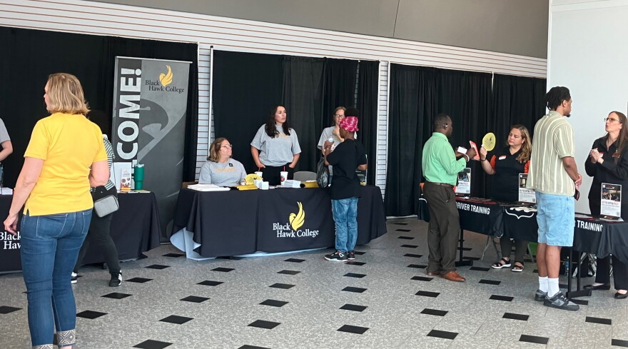 Representatives of Black Hawk College were among many local schools, nonprofits and social service organizations at Wednesday's rapid response resource and job fair at Vibrant Arena, Moline.