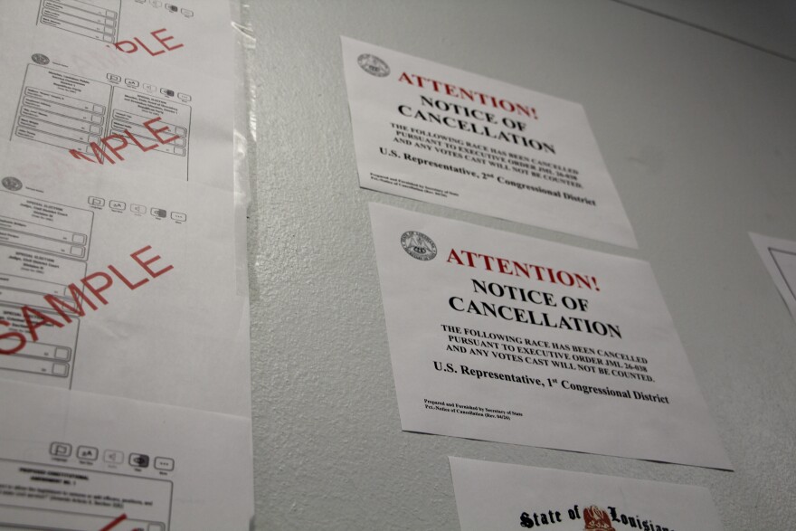 A sign alerting voters to the cancellation of the U.S. House primary race in Louisiana is hung up next to a sample ballot during early voting at the New Orleans City Hall on Tuesday, May 5, 2026.