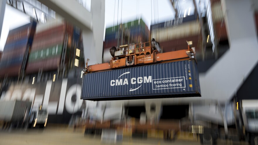 A crane lifts a shipping container from China onto a terminal at the Port of Savannah in Georgia. China's economy grew by just 6.1% last year, a sign that the trade war with the U.S. has taken a toll.