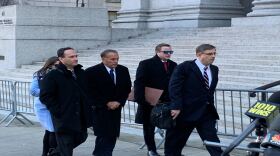 Collins walks into federal court in Manhattan to be sentenced on insider trading charges.