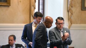 Republican South Carolina Sen. Carlisle Kennedy, left, Democratic Sen. Ronnie Sabb, middle, and Republican Sen. Jeff Zell, right, watch a video during a session on redistricting on Tuesday, May 26, 2026, in Columbia, S.C. (AP Photo/Jeffrey Collins)