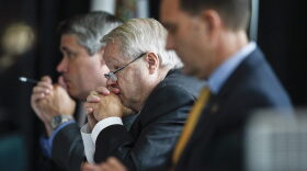 Commissioner Bruce Bartlett, center, listens during a state commission meeting as they investigate the Marjory Stoneman Douglas High School massacre and how Broward school district and others access threats, on Tuesday, July 10, 2018, in Sunrise, Fla. (AP Photo/Brynn Anderson)