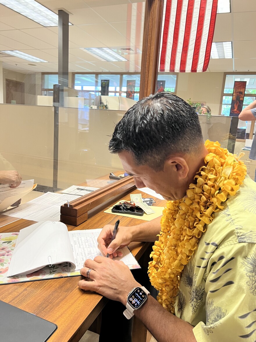Former Congressman Kai Kahele signs paperwork to run for OHA in June 2024.
