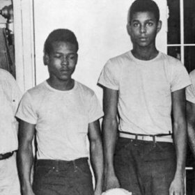 Lake County Sheriff Willis McCall, far left, and an unidentified man stand next to Walter Irvin, Samuel Shepherd and Charles Greenlee, from left, in Florida. The three men along with a fourth were charged with rape in 1949. Florida Gov. Ron DeSantis and a Cabinet granted posthumous pardons Friday, Jan. 11, 2019, to Shepherd, Irvin, Charles Greenlee and Ernest Thomas, the four African-Americans accused of raping a white woman in 1949 in a case now seen as a racial injustice. Relatives of the Groveland Four, as they became known, received restitution totaling $4 million in the 2026-27 Florida budget.