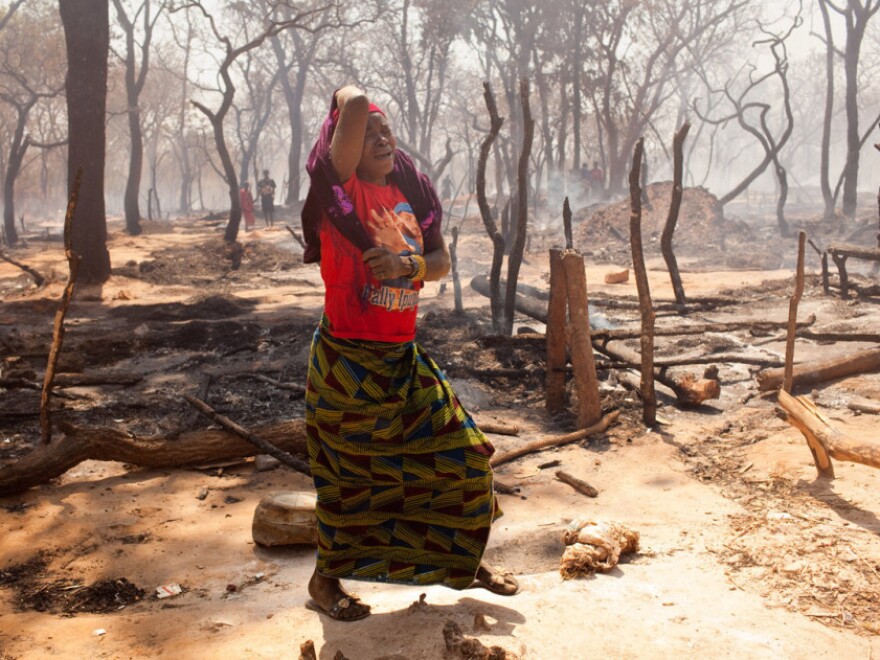 Approximately 100 thatched-grass homes and market kiosks were destroyed in the mining village's fourth fire in two months.