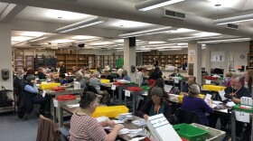  Election workers process ballots in the Lane County Elections office in Eugene on Nov. 8, 2022. 