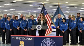 Dept. of Homeland Security Secretary Kristi Noem flanked by TSA employees at Harry Reid International Airport. Nov. 22, 2025