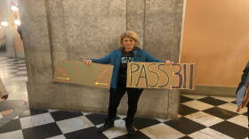One of a few protestors who came to the Statehouse in December to demand the Senate override SB 311.