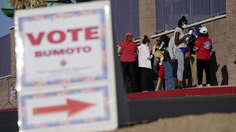 FILE - People wait in line to vote at a polling place on Election Day, Nov. 3, 2020, in Las Vegas. (AP Photo/John Locher, File)