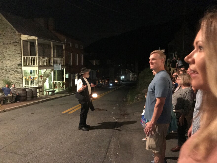 Garland telling one of his ghost stories to a large crowd in Harpers Ferry, W.Va.