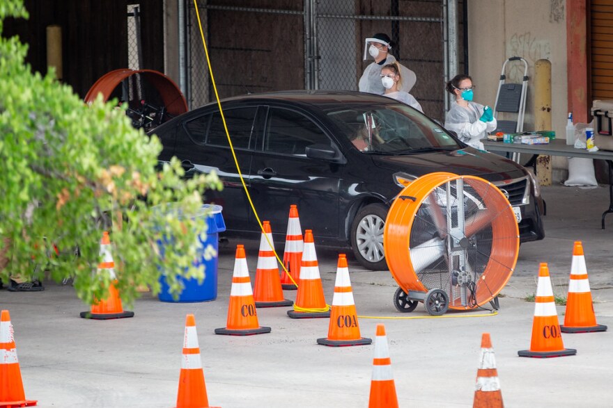 A mobile COVID-19 testing cite operates off of Interstate 35 in North Austin on May 22.