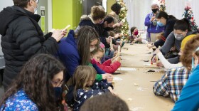 Kids are enjoying activities with their parents at Everson Museum of Art.